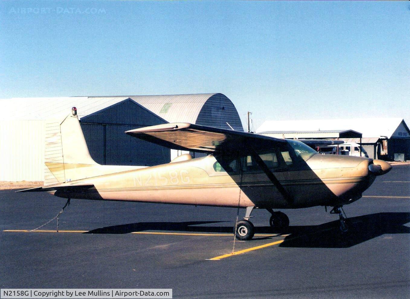N2158G, 1958 Cessna 182A Skylane C/N 51458, Gold & bronze metallic painted 182, tied down at Safford AZ. C1999