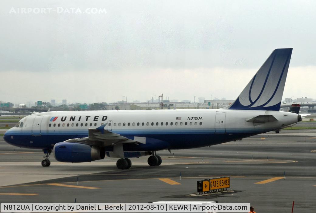 N812UA, 1998 Airbus A319-131 C/N 850, A United Airbus taxies under a dark, stormy sky at Newark.