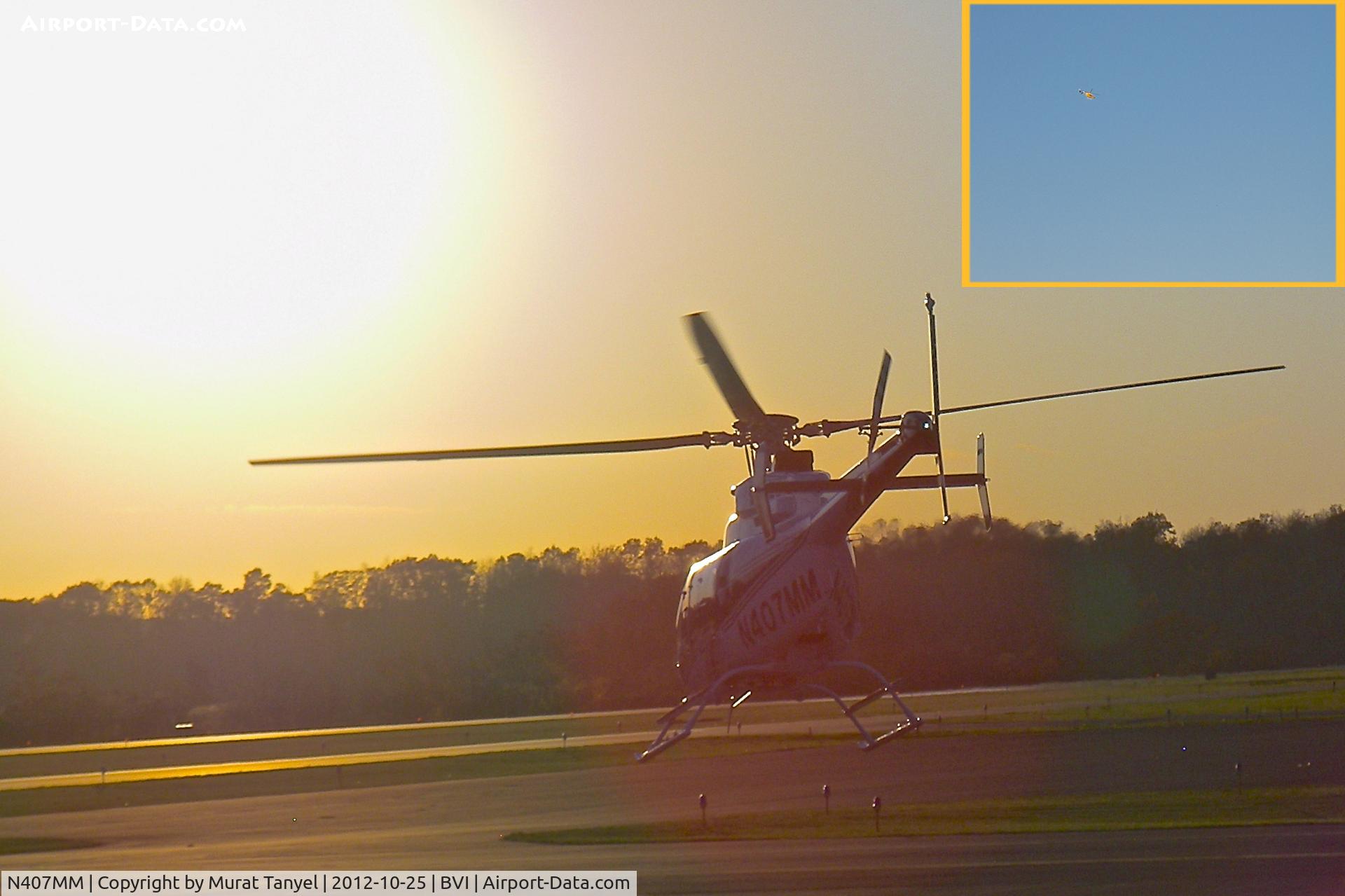 N407MM, 2012 Bell 407 C/N 54324, N407MM takes off into the sunset, flies away from it.