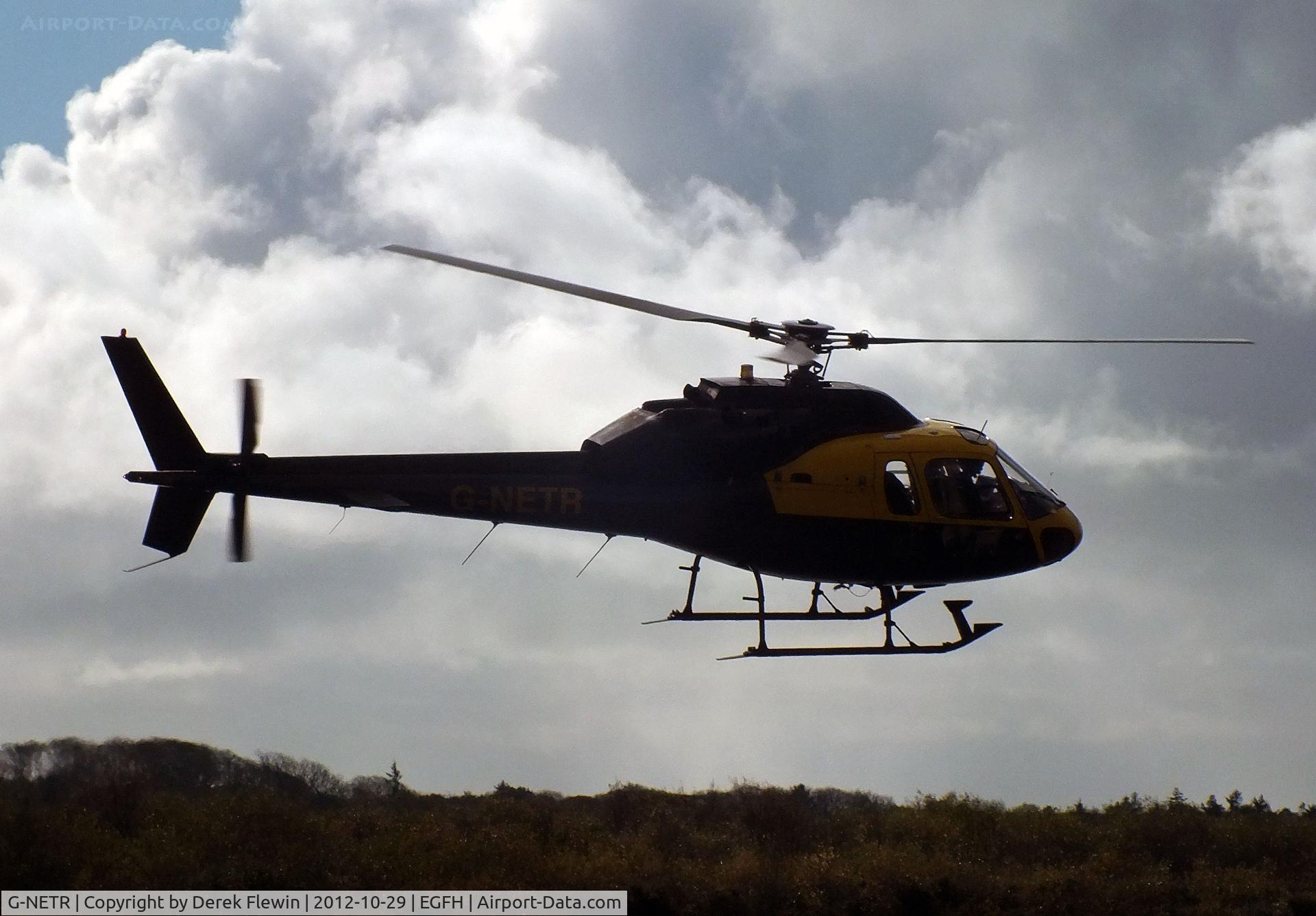 G-NETR, 1982 Aerospatiale AS-355F-1 Ecureuil 2 C/N 5164, Departing EGFH to the West.