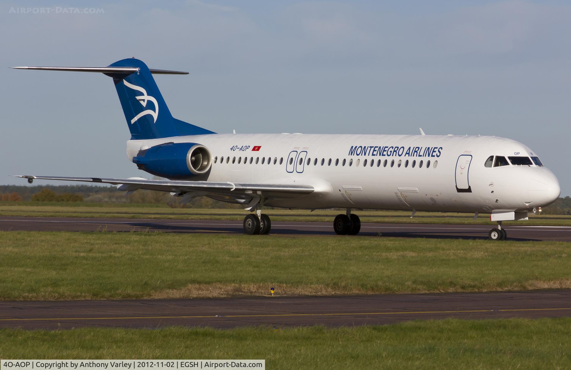 4O-AOP, 1991 Fokker 100 (F-28-0100) C/N 11332, About to depart EGSH after spray by Air Livery.
