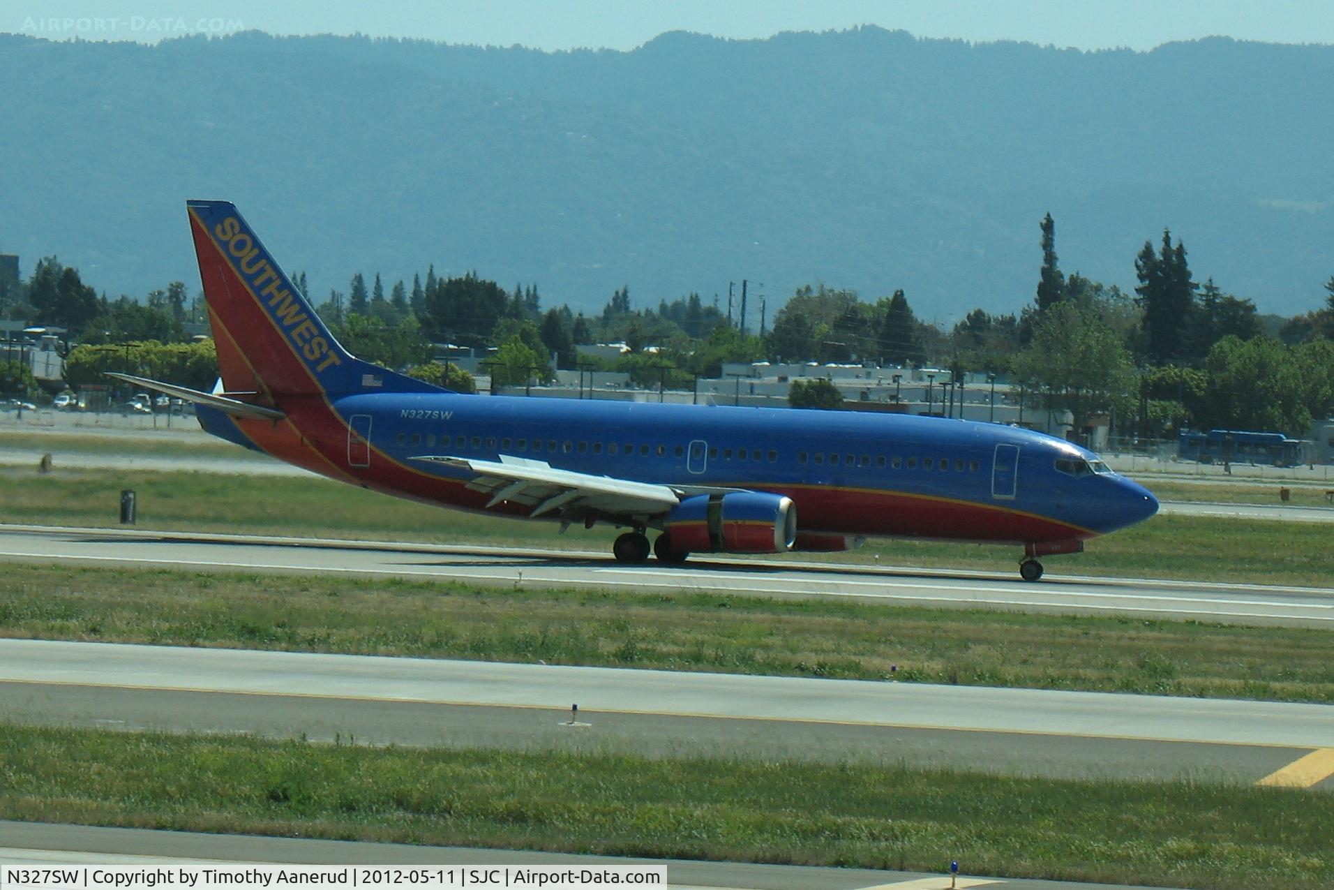 N327SW, 1987 Boeing 737-3H4 C/N 23691, All of the passengers are now using their cell phones to call somebody and say 