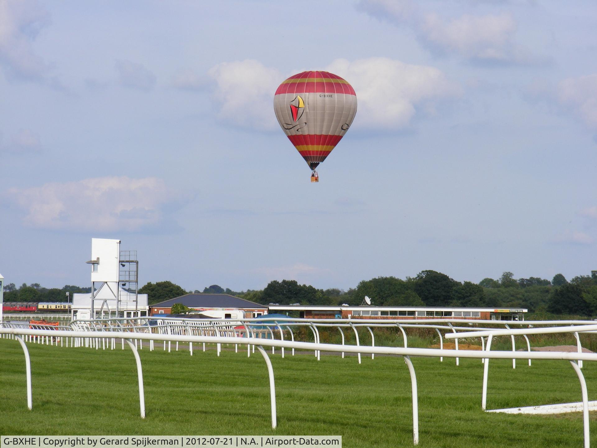 G-BXHE, 1997 Lindstrand Balloons LBL 105A C/N 459, Picture taken in our holiday. Location Stratford upon Avon, horseracecourt, also used as campsite.
