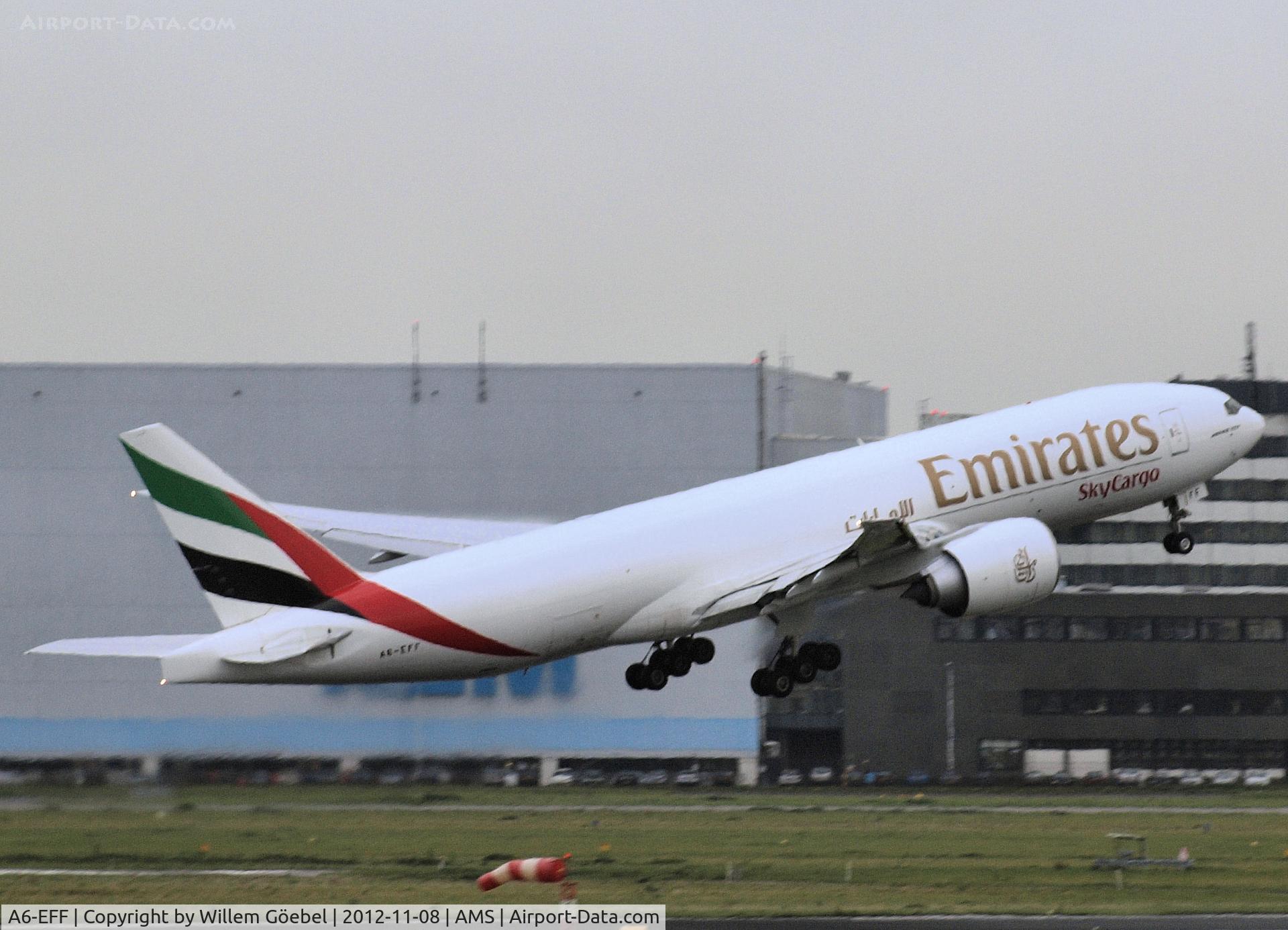 A6-EFF, 2011 Boeing 777-F1H C/N 35612, Take off from runway L 18 of Schiphol Airport