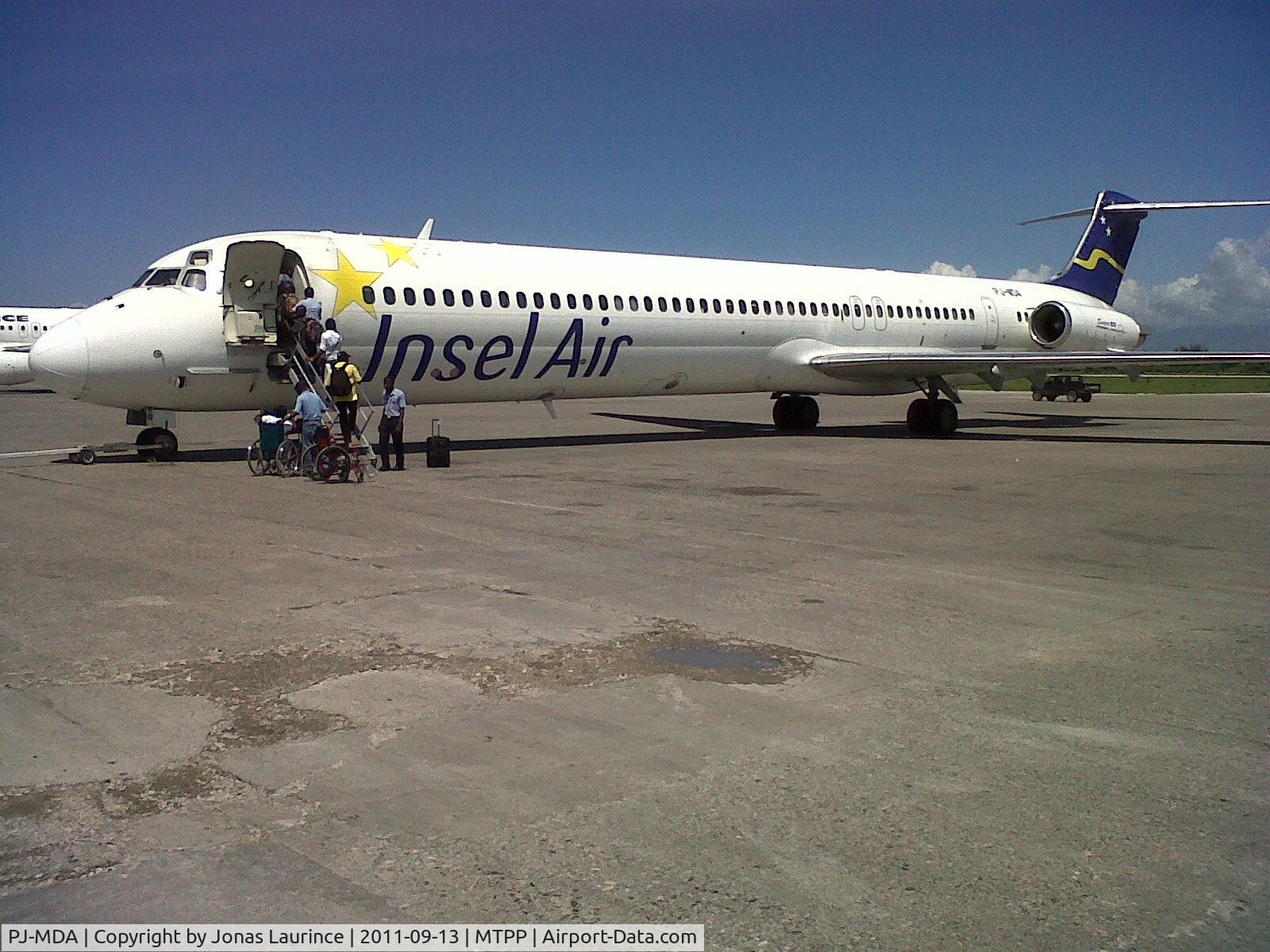 PJ-MDA, 1987 McDonnell Douglas MD-83 (DC-9-83) C/N 49449, Boarding at Insel Air aircraft at the Toussaint Louverture International Airport of Port-au-Prince (Direction Miami international Airport MIA)