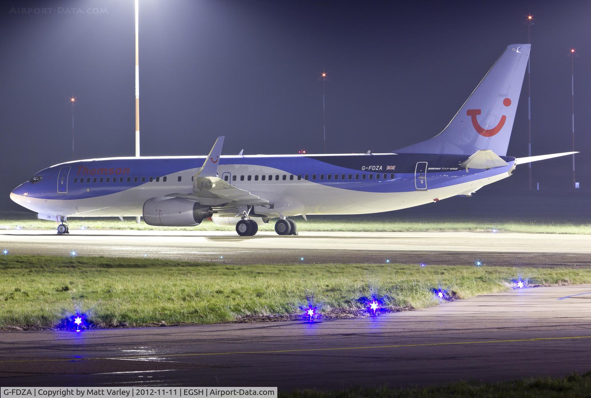 G-FDZA, 2007 Boeing 737-8K5 C/N 35134, Sat on stand after spray in to Thomson's Dreamliner livery.