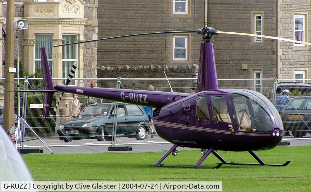 G-RUZZ, 2003 Robinson R44 Raven II C/N 10082, Originally owned to, Heli Air Ltd in May 2003 and currently with, Russell Harrison plc since September 2003. Photo taken in Weston-super-Mare sea-front.