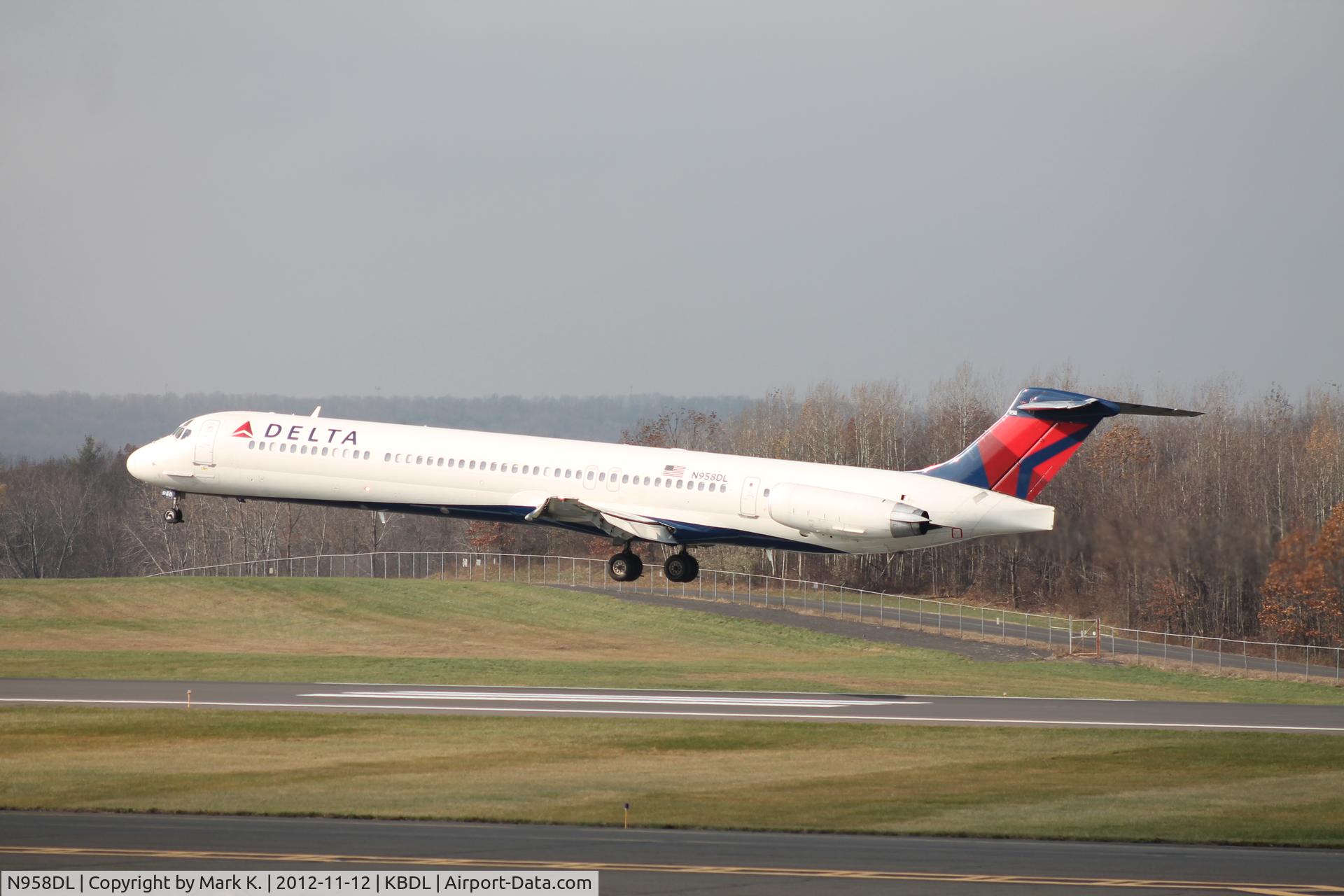N958DL, 1990 McDonnell Douglas MD-88 C/N 49977, Delta flight 1430 from Detroit Metro is just a couple of feet from touching down on runway 24.