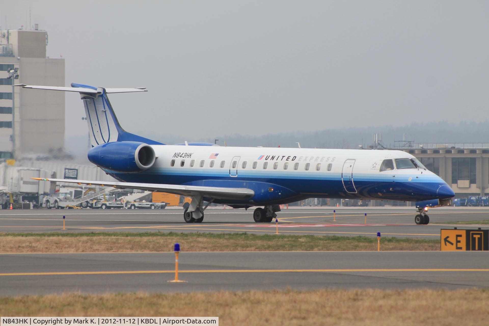 N843HK, 2004 Embraer EMB-145LR C/N 14500822, Trans States ERJ-145 flight 3372 taxiing across runway 33.