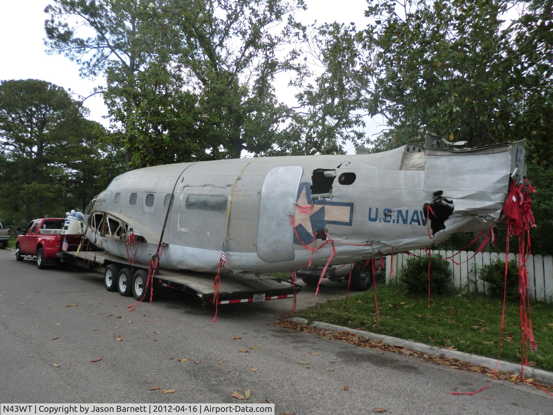 N43WT, 1943 Lockheed 18-56 Lodestar Lodestar C/N 18-2565, Here the fuselage is after we got home from the car show in Austin TX. A few hours later it would be cut in half, in preparation for its new life as a display in FtWorth.
We had acquired several tickets from the police while towing it.