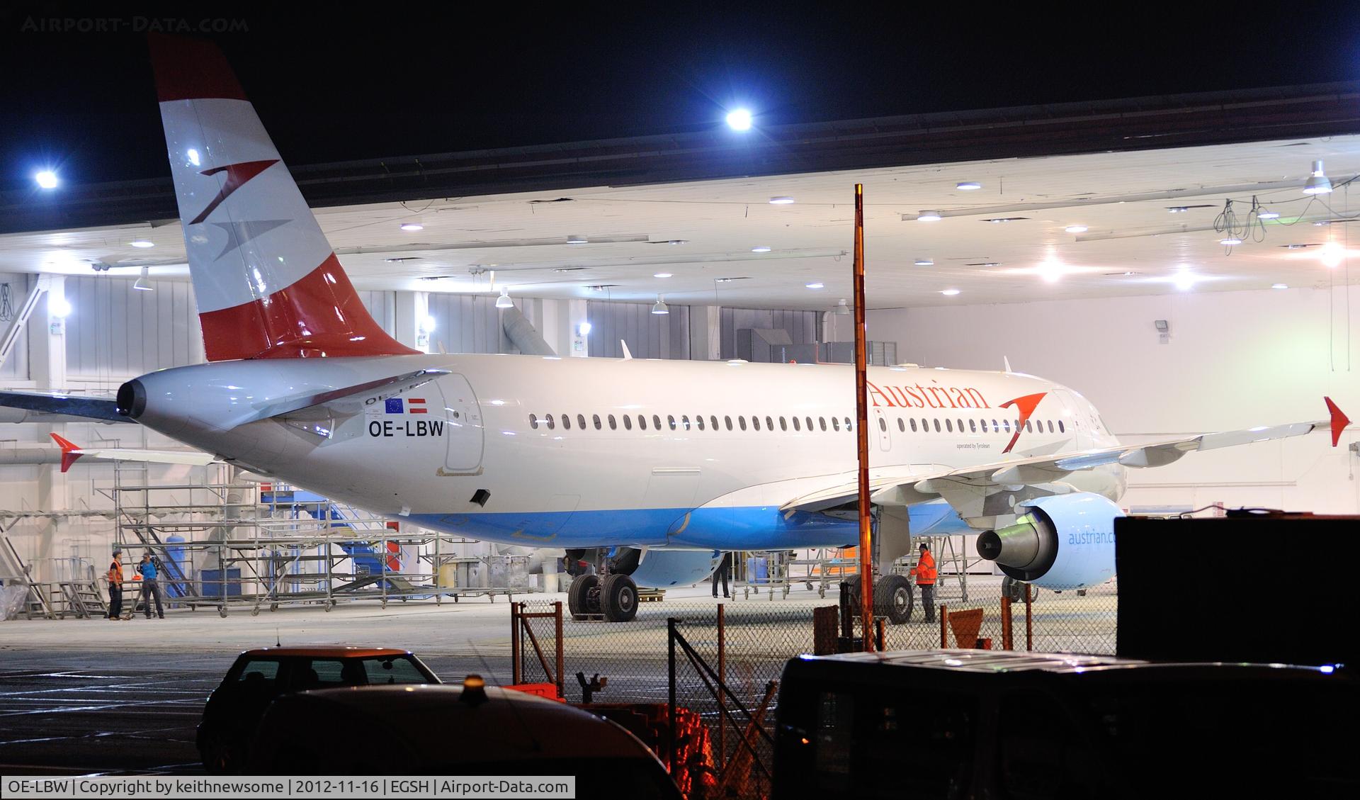 OE-LBW, 2001 Airbus A320-214 C/N 1678, About to be pushed out of sprayshop, with vehicle barrier in shot !!