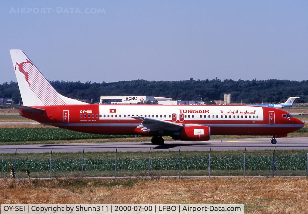 OY-SEI, 1999 Boeing 737-85H C/N 29445, Taxiing holding point rwy 14L for departure... Tunisair summer lease 2000...