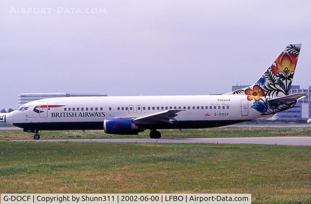 G-DOCF, 1991 Boeing 737-436 C/N 25407, Taxiing holding point rwy 32R for departure in 'Cockerel of Lowicz' tail c/s