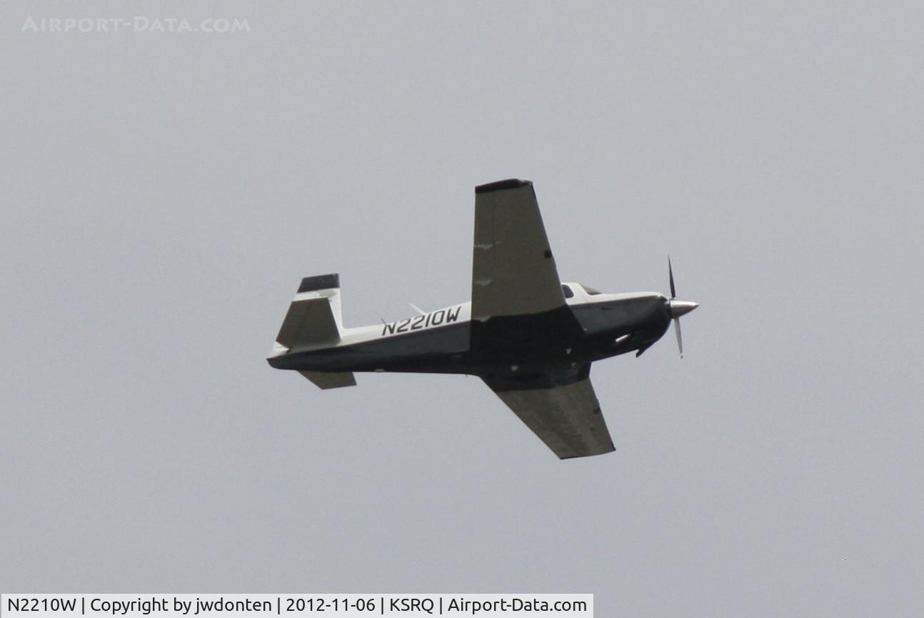 N2210W, 1998 Mooney M20J 201 C/N 24-3423, Mooney M-20 (N2210W) departs Sarasota-Bradenton International Airport enroute to Witham Field