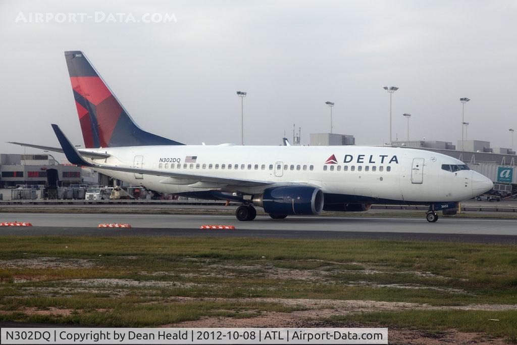 N302DQ, 2008 Boeing 737-732 C/N 29648, Delta Air Lines N302DQ (FLT DAL1265) taxiing to Gate E31 after arrival from Savannah/Hilton Head (KSAV).