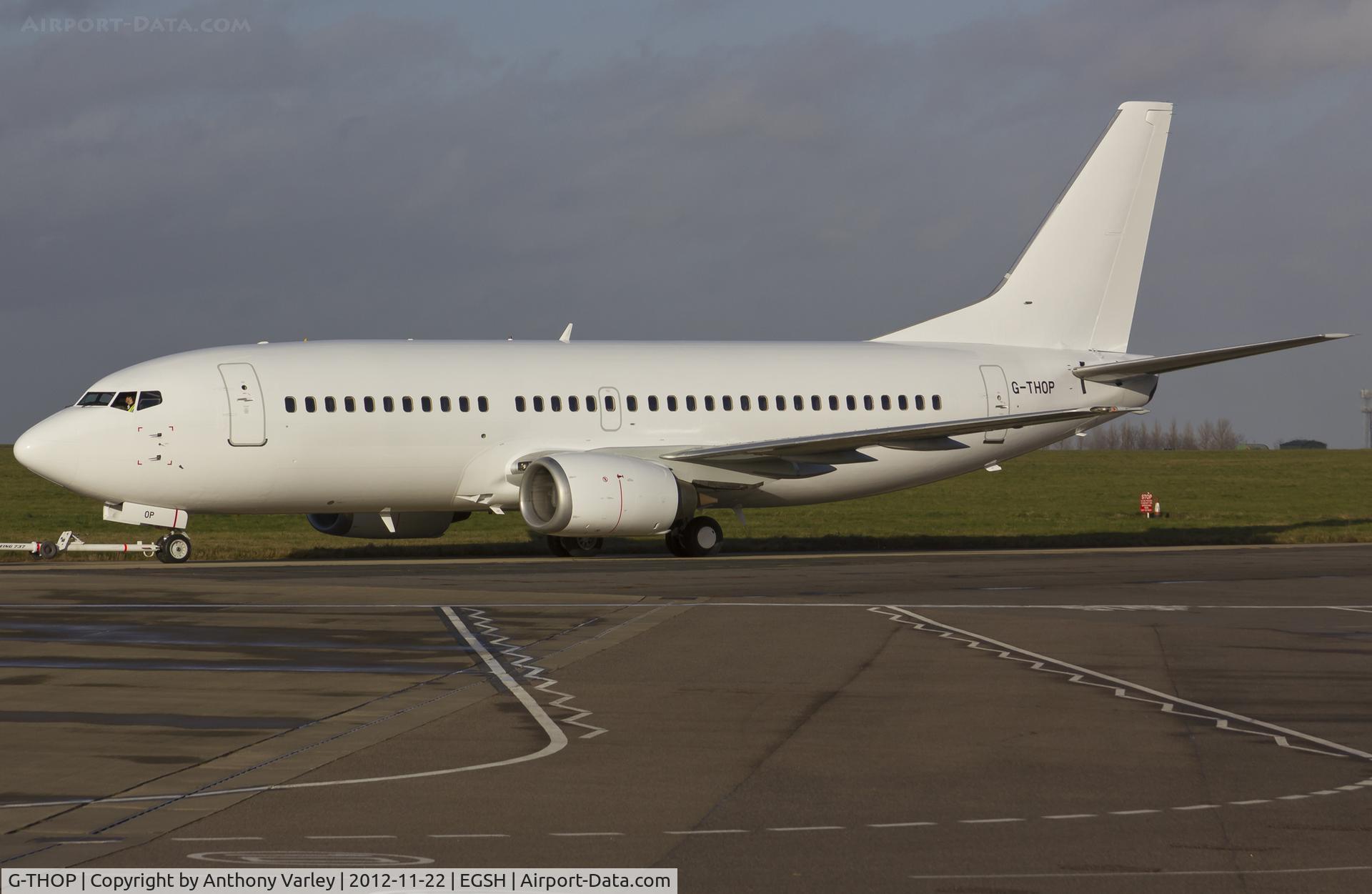 G-THOP, 1998 Boeing 737-3U3 C/N 28740, Being towed past stand 6 after spray by Air Livery.