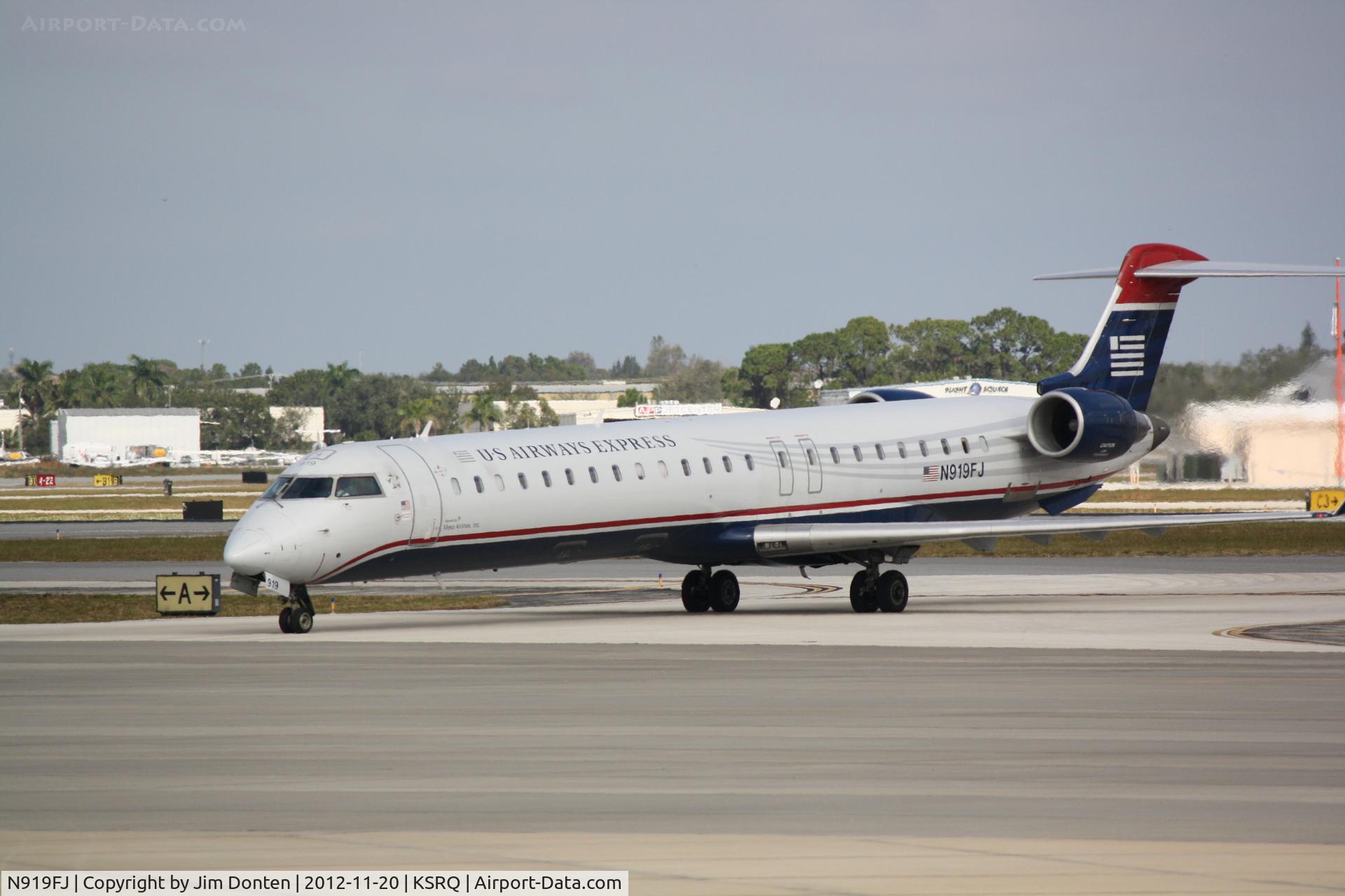 N919FJ, 2004 Bombardier CRJ-900ER (CL-600-2D24) C/N 15019, US Air Flight 2675 operated by Mesa (N919FJ) arrives at Sarasota-Bradenton International Airport following a flight from Charlotte-Douglas International Airport