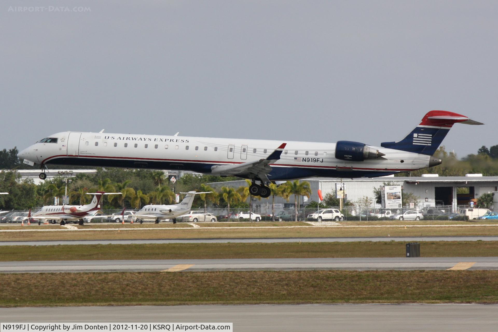 N919FJ, 2004 Bombardier CRJ-900ER (CL-600-2D24) C/N 15019, US Air Flight 2675 operated by Mesa (N919FJ) arrives at Sarasota-Bradenton International Airport following a flight from Charlotte-Douglas International Airport