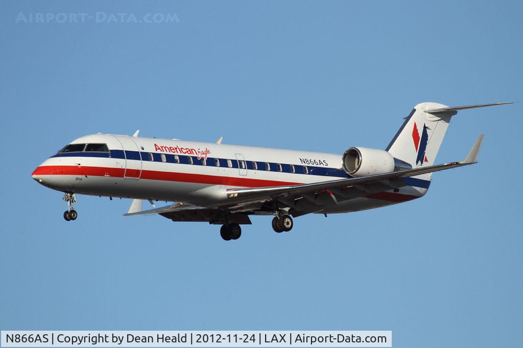 N866AS, 2001 Bombardier CRJ-200ER (CL-600-2B19) C/N 7517, American Eagle (SkyWest Airlines) N866AS (FLT SKW2610) from San Diego Int'l (KSAN) on short final to RWY 25L. SkyWest recently started a contract with American Eagle.