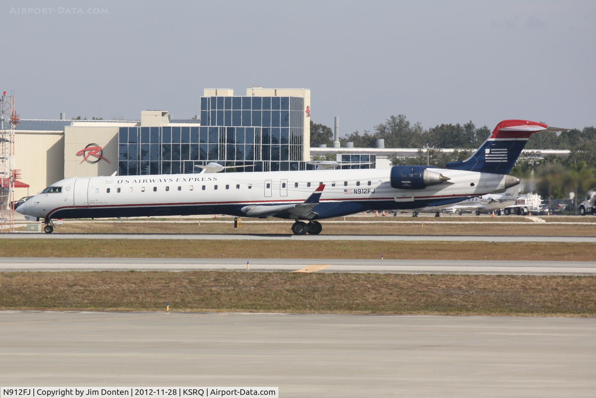 N912FJ, 2004 Bombardier CRJ-900ER (CL-600-2D24) C/N 15012, US Air Flight 2687 operated by Mesa (N912FJ) departs Sarasota-Bradenton International Airport enroute to Charlotte-Douglas International Airport