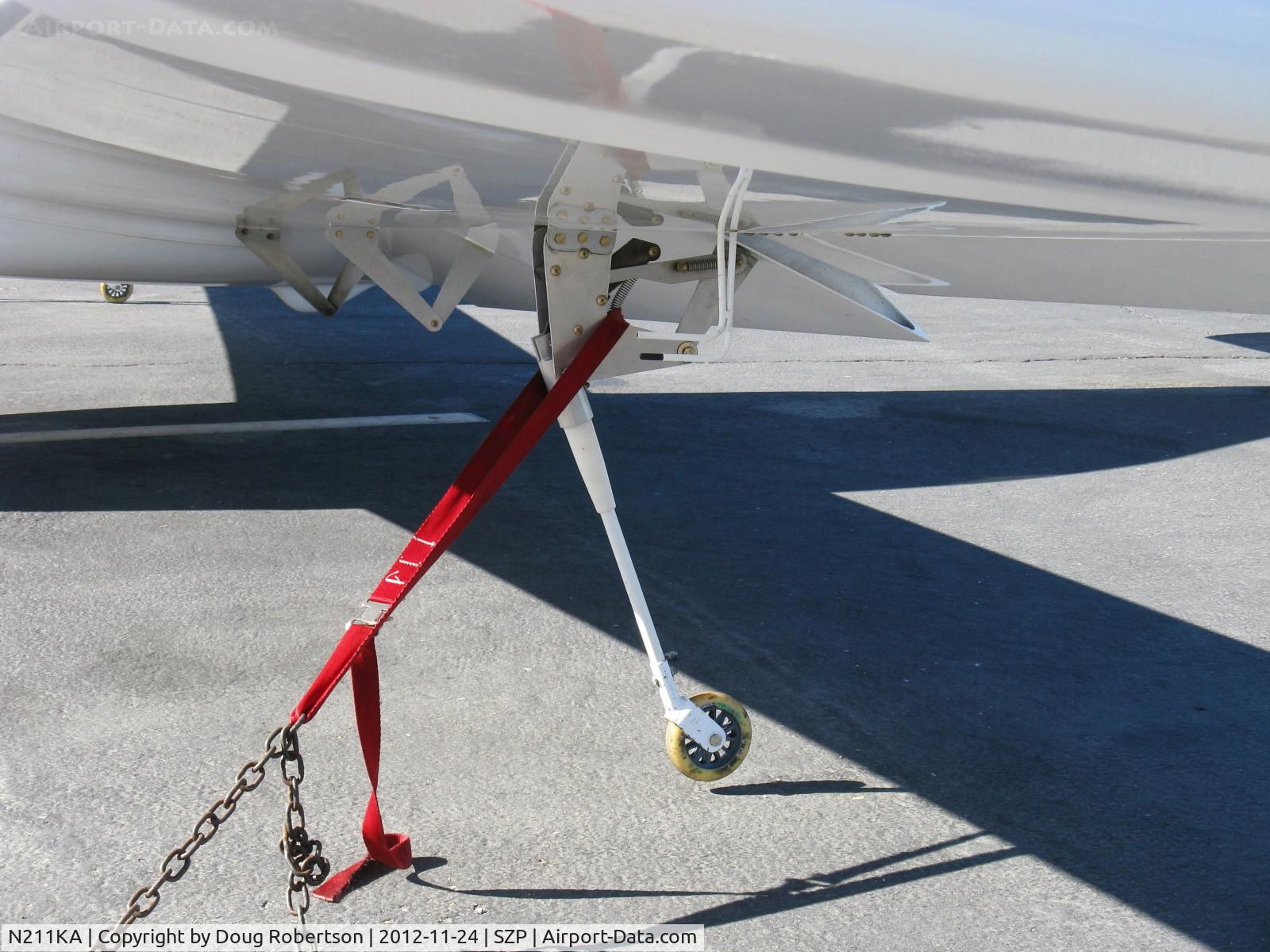 N211KA, Europa XS Monowheel C/N 01, 2003 Klinefelter EUROPA XS, Rotax 914UL turbocharged 113.4 Hp, closeup of near mid-span outrigger wheel-they go up or down with the flaps-so every landing should be a flap landing-hopefully.