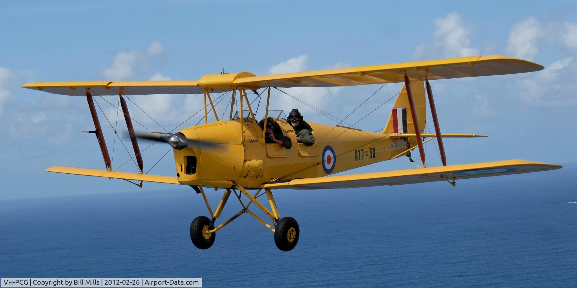 VH-PCG, 1940 De Havilland Australia DH-82A Tiger Moth C/N DHA55, VH-PCG flying over the beaches at Byron Bay NSW