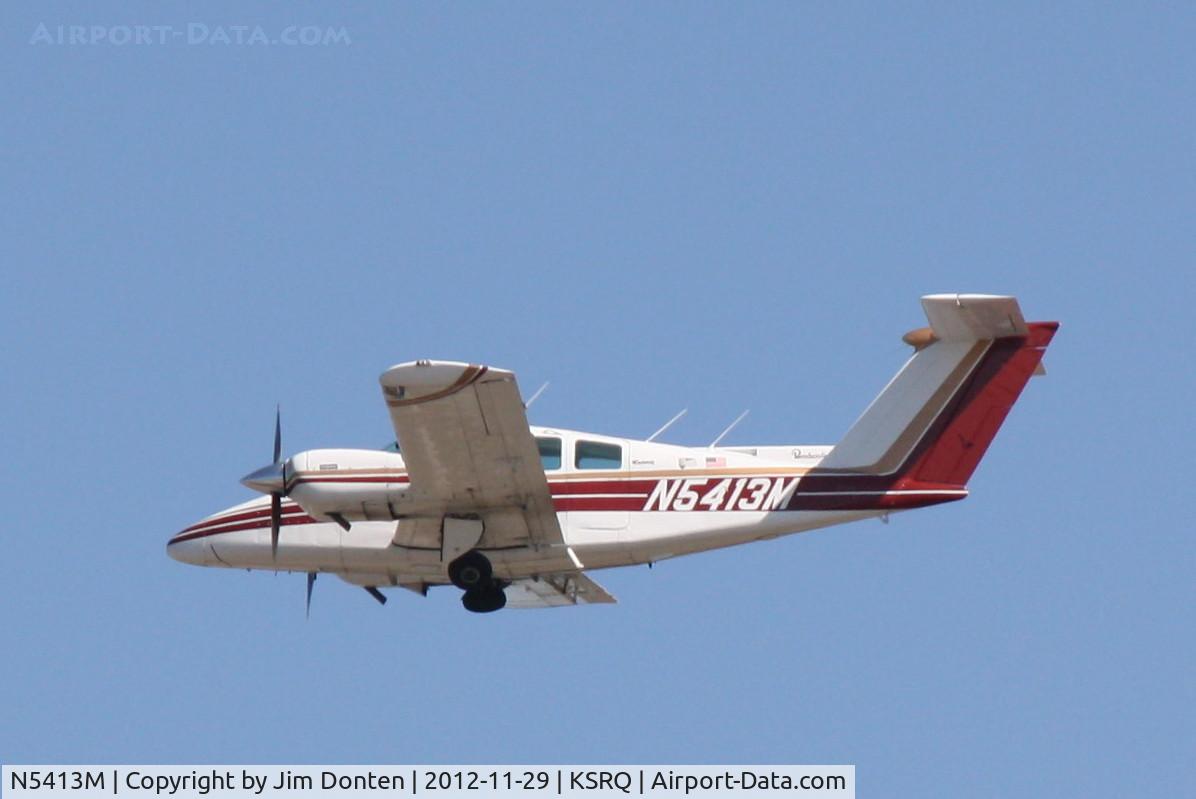 N5413M, 1978 Beech 76 Duchess C/N ME-33, Beechcraft Duchess (N5413M) departs Sarasota-Bradenton International Airport
