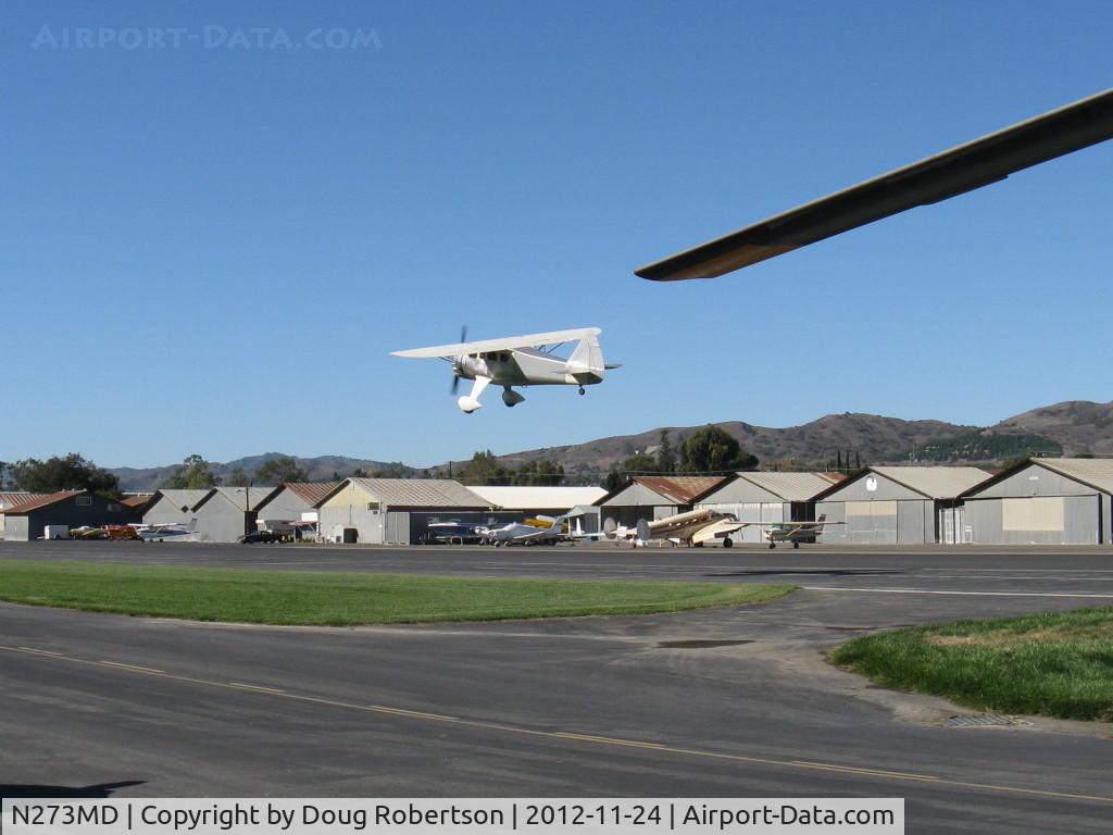 N273MD, 2008 Dickenson Howard DGA-21 (Replicate) C/N 001, 2008 DICKENSON HOWARD DGA-21 'Mr. DICKENSON', P&W R-1340-57 Wasp 600 Hp, takeoff climb Rwy 22-fortuitous 'grab' shot from behind a helicopter alerted by the NOISE! This one-off aircraft get's one's attention.