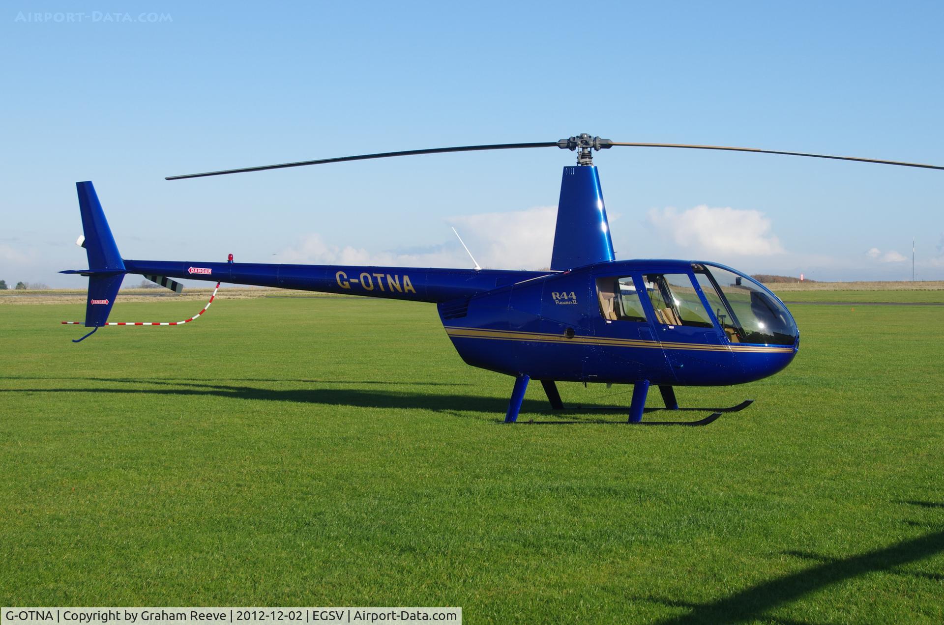 G-OTNA, 2006 Robinson R44 Raven II C/N 11092, Parked in the sun.