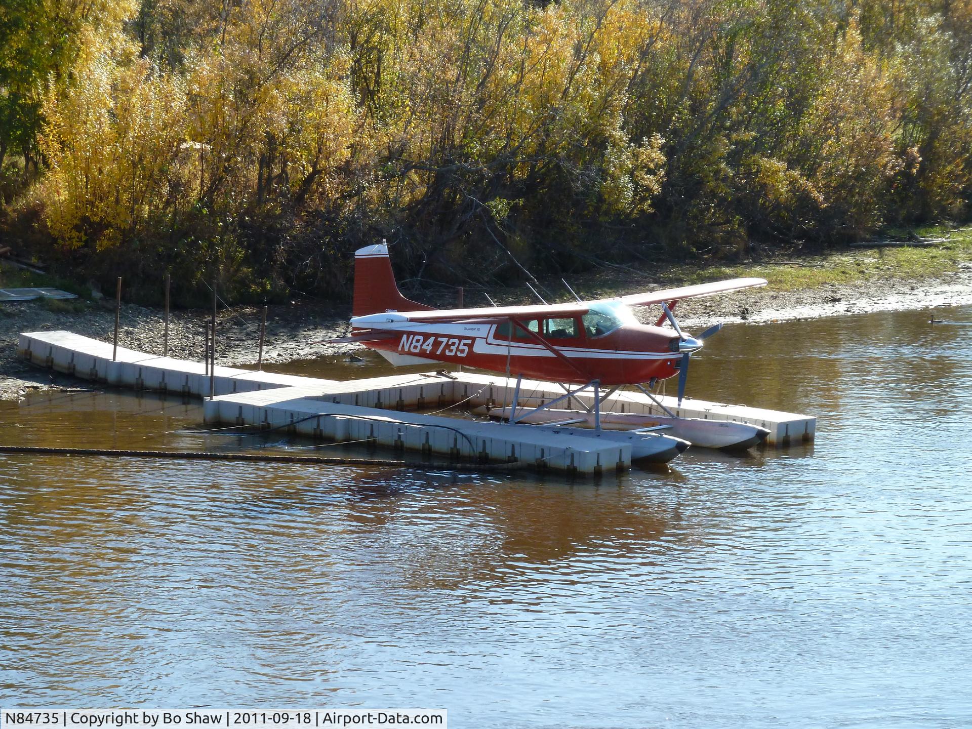 N84735, 1976 Cessna A185F Skywagon 185 C/N 18503152, This picture was taken in the morning from a river boat on the Tanan River in Fairbanks, Alaska. It was alongside a single pier.