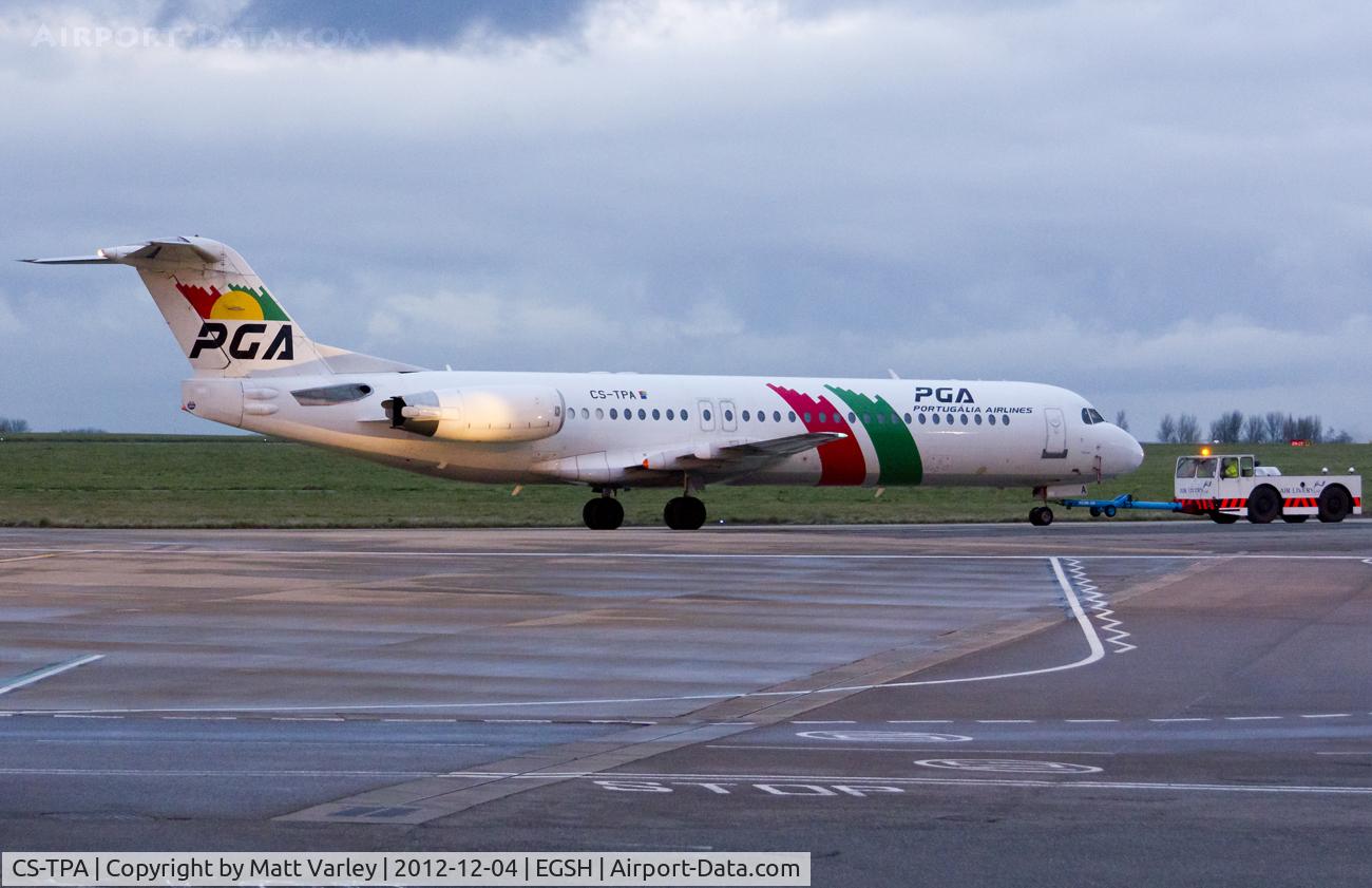 CS-TPA, 1989 Fokker 100 (F-28-0100) C/N 11257, Being pulled to the Air Livery hangar after the sun had set.