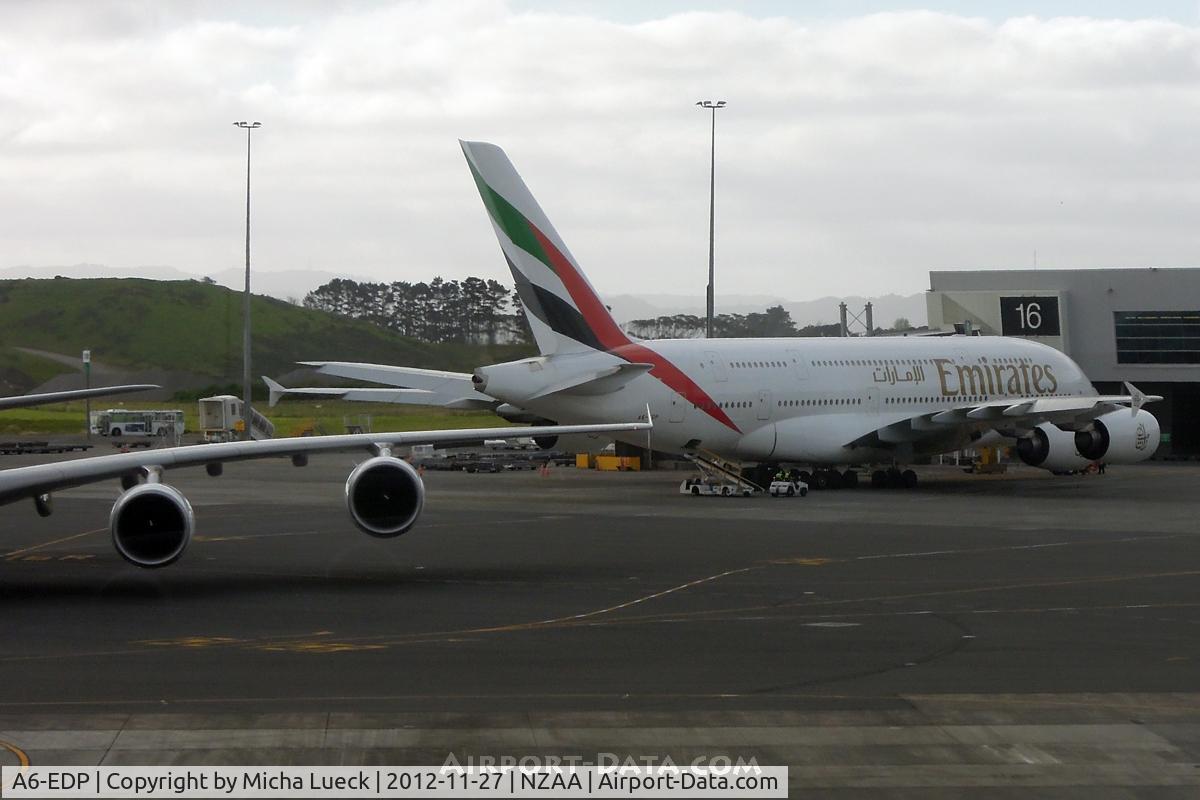 A6-EDP, 2011 Airbus A380-861 C/N 077, A6-EDP with the massive wing of A6-EDD in the foreground