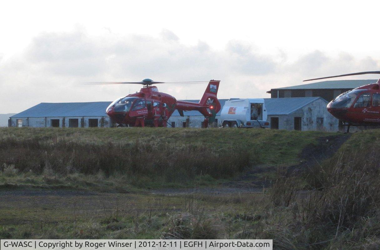 G-WASC, 2012 Eurocopter EC-135T-2+ C/N 1074, Helimed 59. The new mid-Wales Air Ambulance helicopter drops in for a hot refuel before returning to it's base at Welshpool Airport. Replaced Bo 105DBS-4 helicopter G-WAAS on 2nd November 2012.
