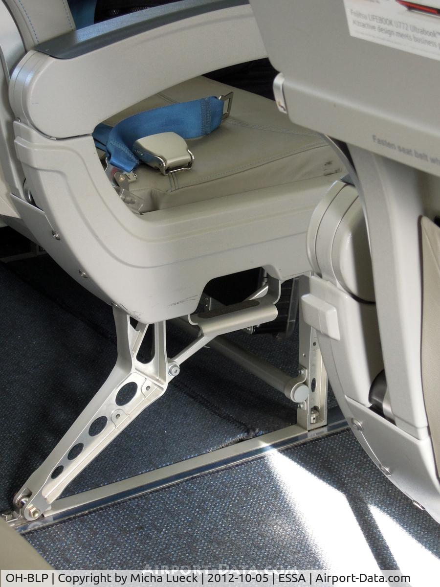 OH-BLP, 2000 Boeing 717-23S C/N 55064, Never seen those steps in the seat before. They help small/short people get to the overhead bins. Cool!