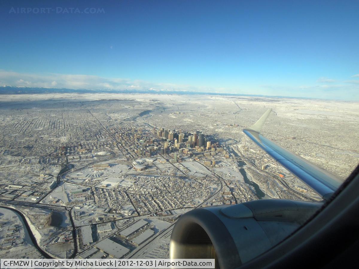 C-FMZW, 2007 Embraer 190AR (ERJ-190-100IGW) C/N 19000124, Climbing out of Calgary, on the way to Vancouver