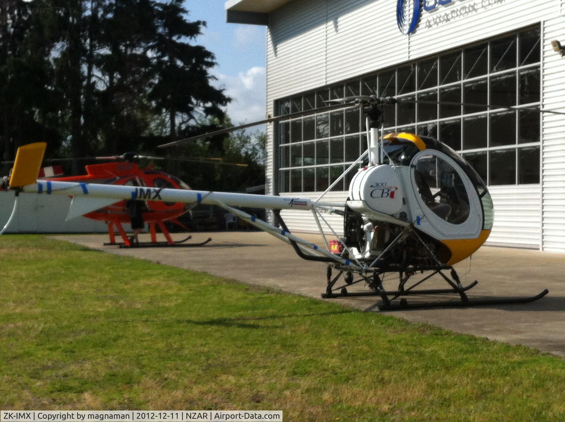 ZK-IMX, 2007 Schweizer 269C-1 C/N 316, Outside oceania hangar - ardmore

ZK-HIP in background