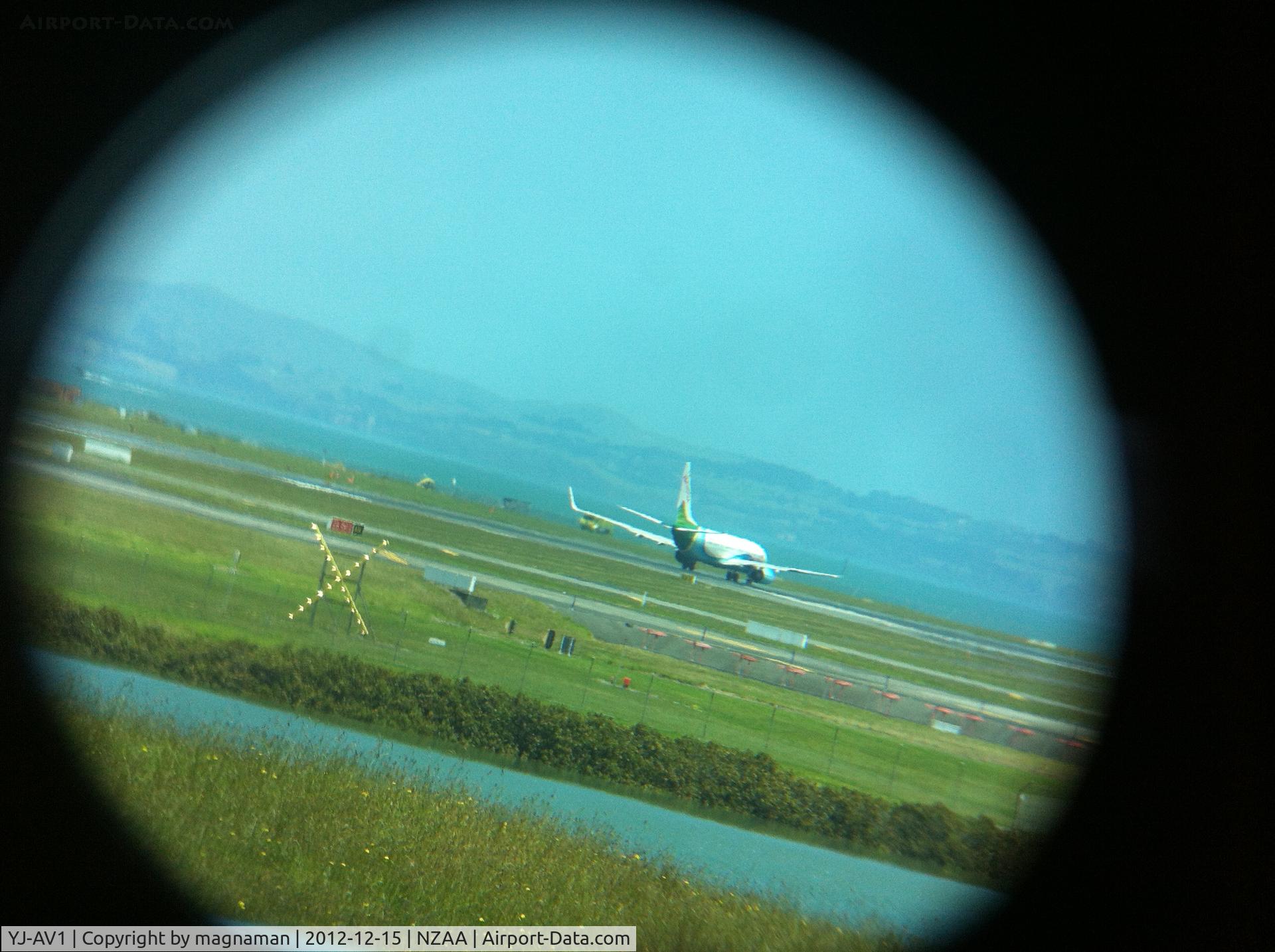 YJ-AV1, 2007 Boeing 737-8Q8 C/N 30734, I know you cannot see great detail but thought trying to use my iphone through the binoculars gave an unusal photo.