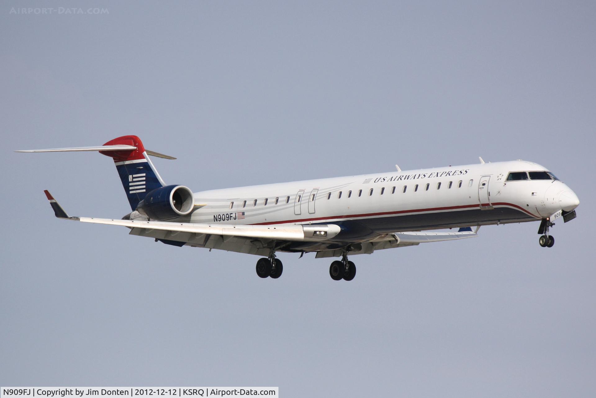 N909FJ, 2003 Bombardier CRJ-900ER (CL-600-2D24) C/N 15009, US Air Flight 2675 operated by Mesa (N909FJ) arrives at Sarasota-Bradenton International Airport following a flight from Charlotte-Douglas International Airport