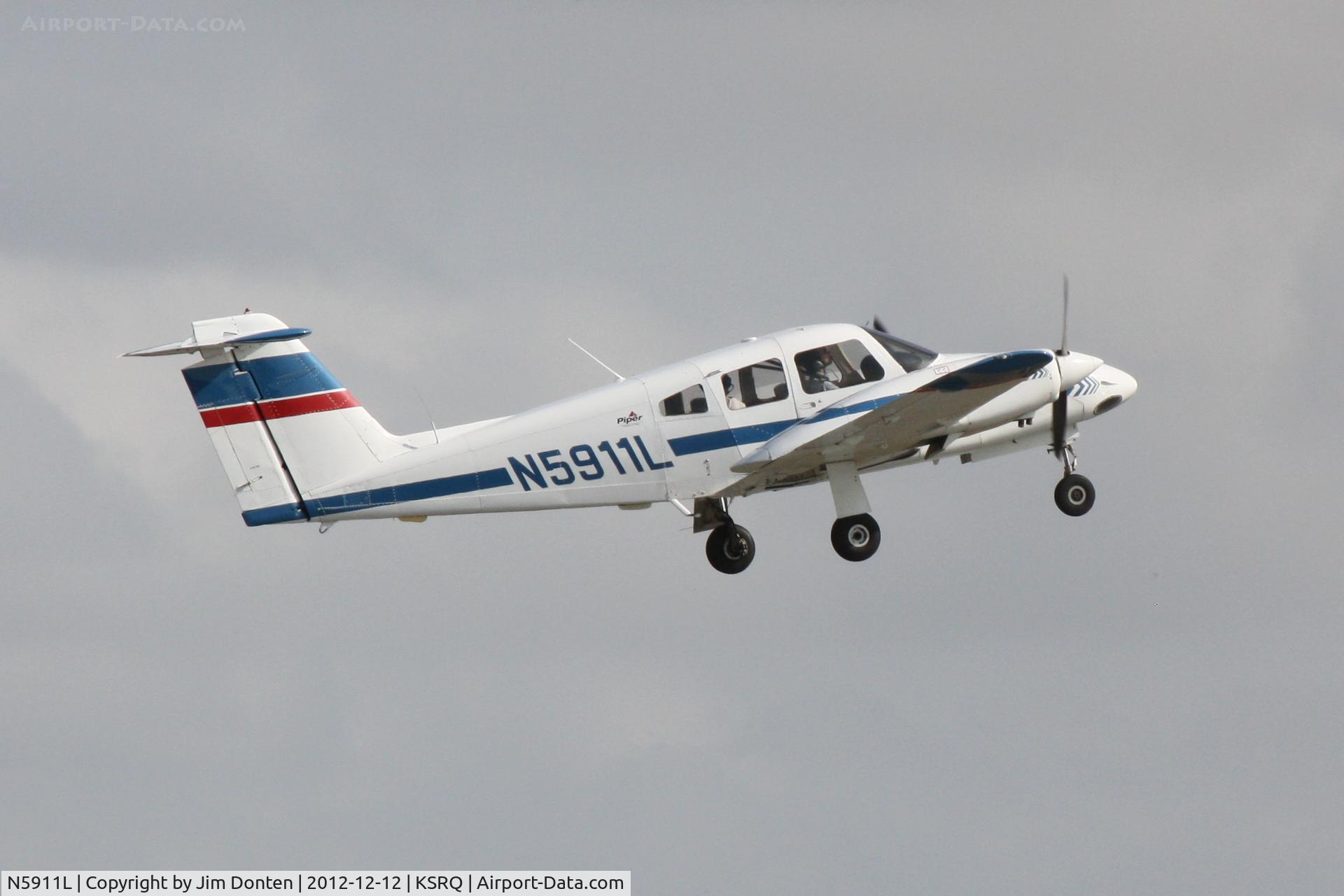 N5911L, 2001 Piper PA-44-180 Seminole C/N 4496102, Piper Turbo Seminole (N5911L) departs Sarasota-Bradenton International Airport enroute to Sebring Regional Airport