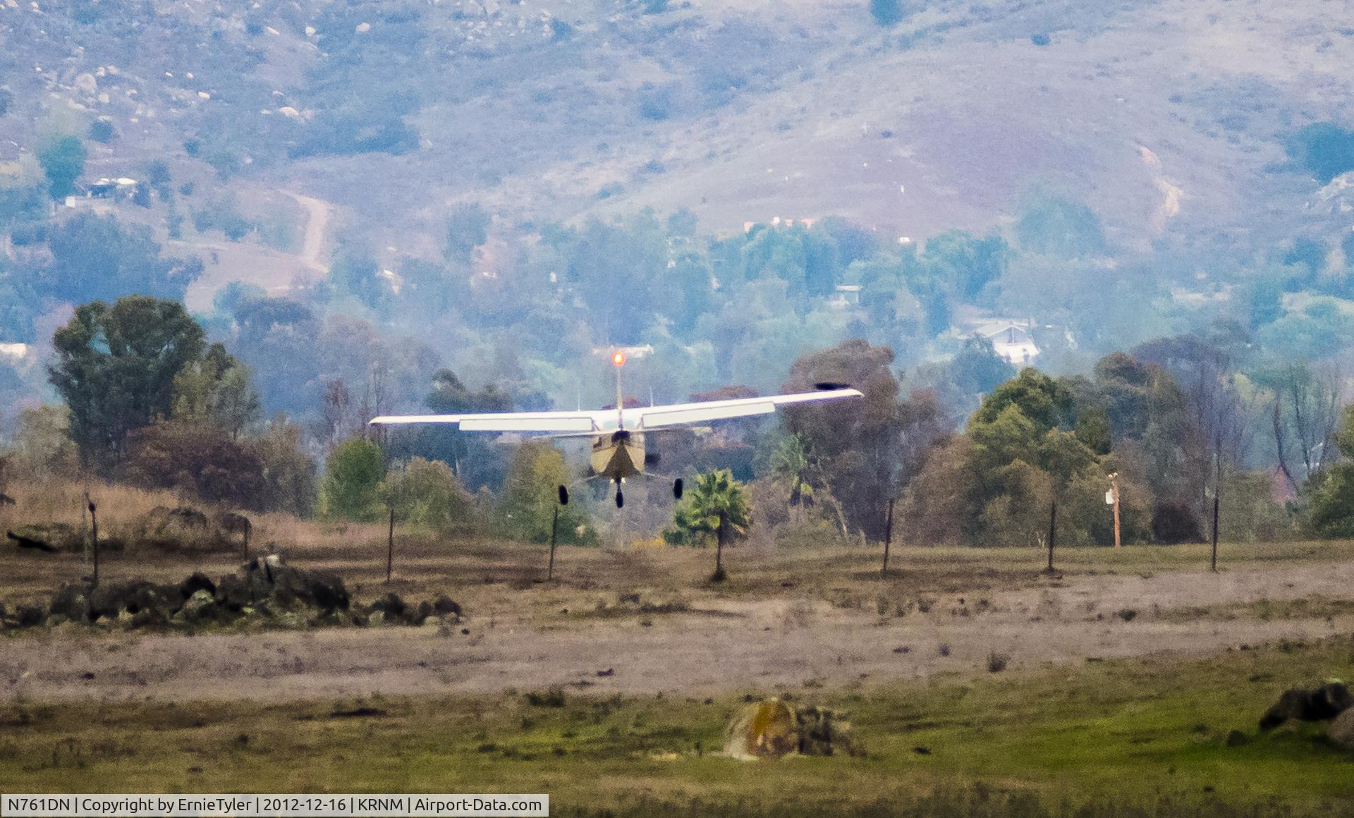 N761DN, 1977 Cessna T210M Turbo Centurion C/N 21062175, The Cessna is landing at KRNM (Ramona, CA) from the west.  This photo provides the illusion that the aircraft must be landing on a dirt strip but the Ramona runway is just beyond the mound.