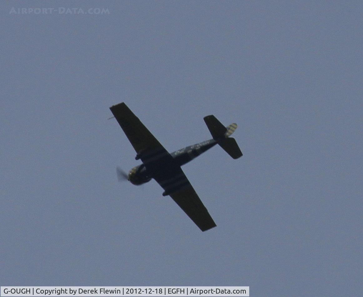 G-OUGH, 1987 Bacau Yak-52 C/N 877404, seen doing aeros over Killay.