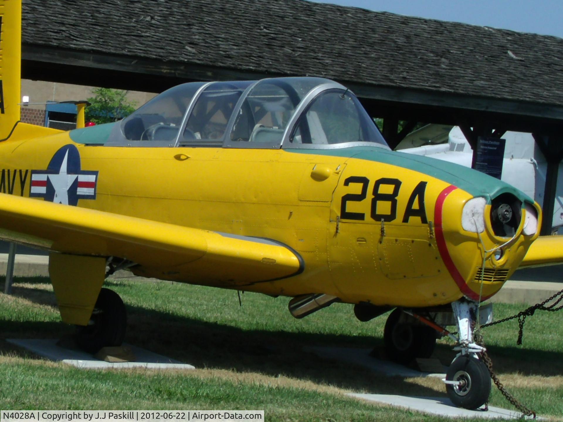 N4028A, 1961 Beech D-45 Mentor C/N BG-297, angle view. Notice the exhaust pipes below the engine