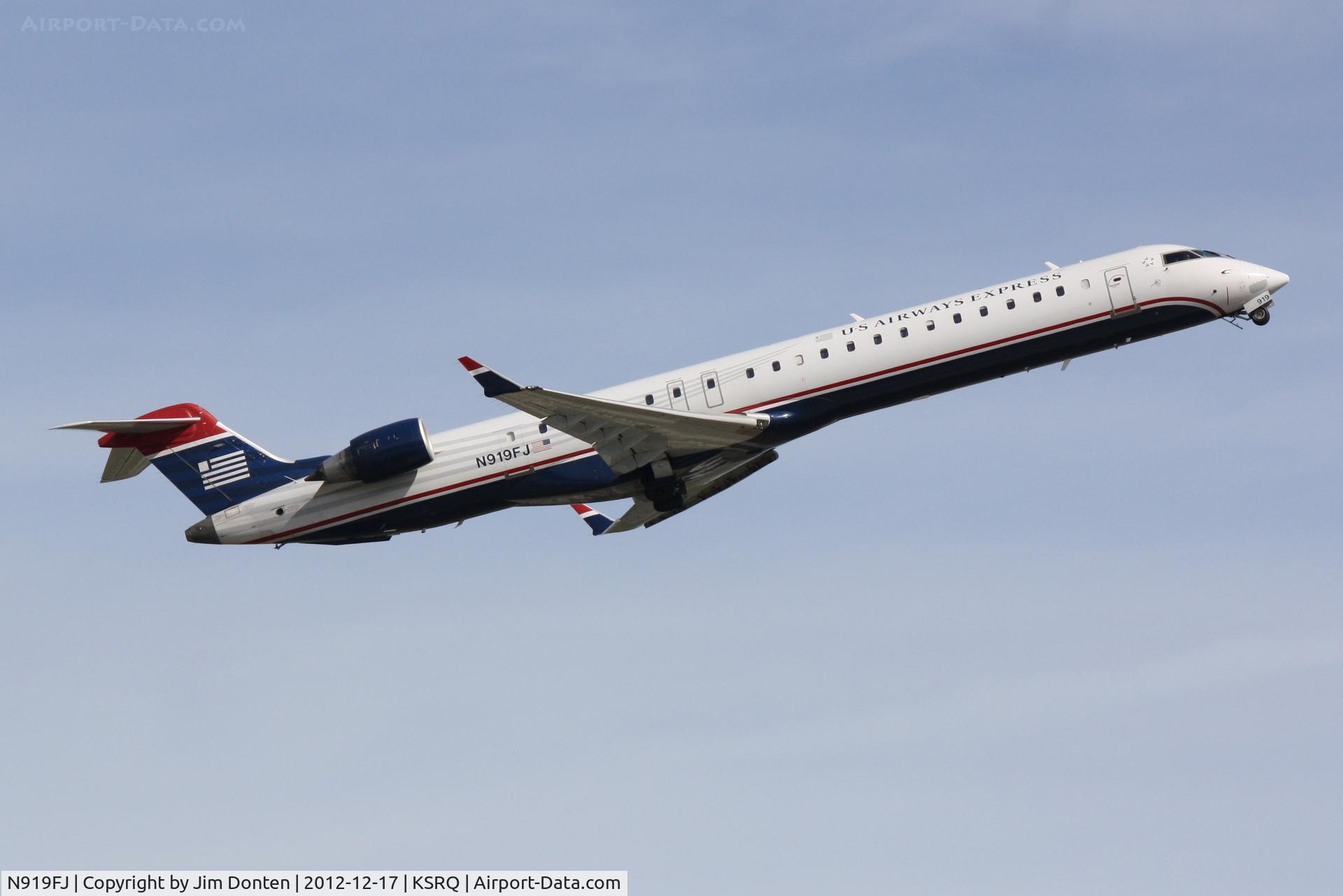 N919FJ, 2004 Bombardier CRJ-900ER (CL-600-2D24) C/N 15019, US Air Flight 2678 operated by Mesa (N919FJ) departs Sarasota-Bradenton International Airport enroute to Charlotte-Douglas International Airport