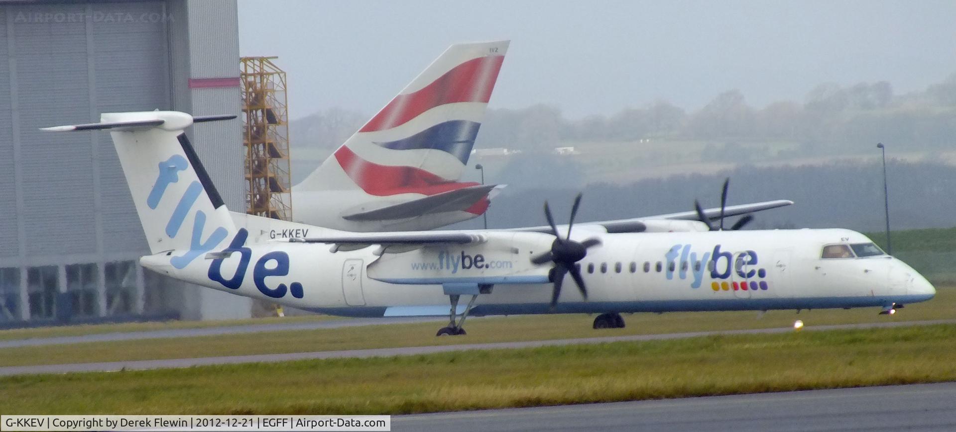 G-KKEV, 2008 De Havilland Canada DHC-8-402Q Dash 8 C/N 4201, Landed 1137, CS Jersey 35A from Belfast City, Thanks to S.W.A.G. Tail in background belongs to BA 747 G-CIVZ.