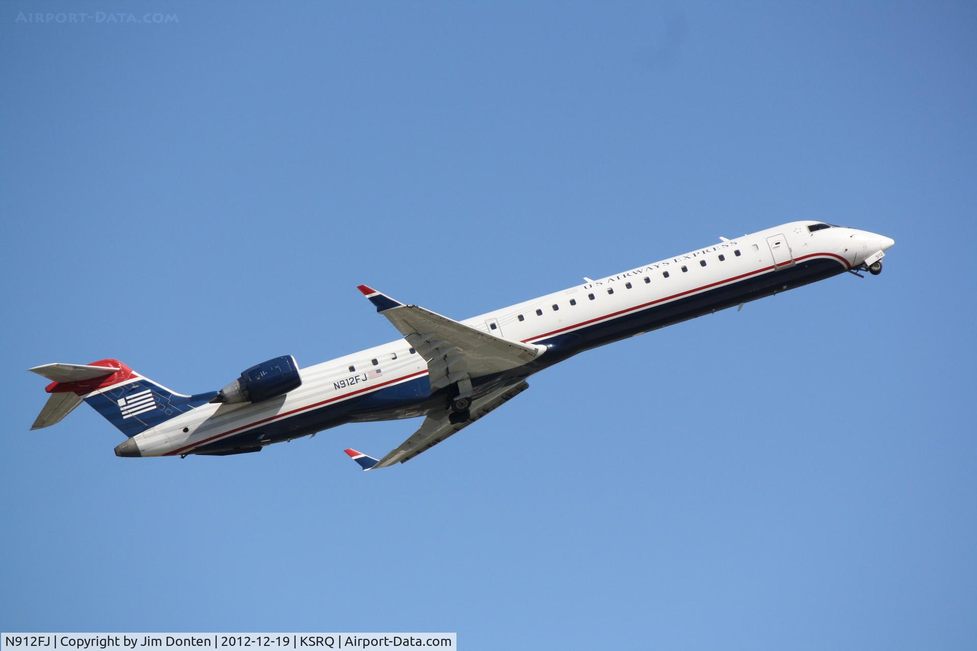 N912FJ, 2004 Bombardier CRJ-900ER (CL-600-2D24) C/N 15012, US Air Flight 2678 operated by Mesa (N912FJ) departs Sarasota-Bradenton International Airport enroute to Charlotte-Douglas International Airport