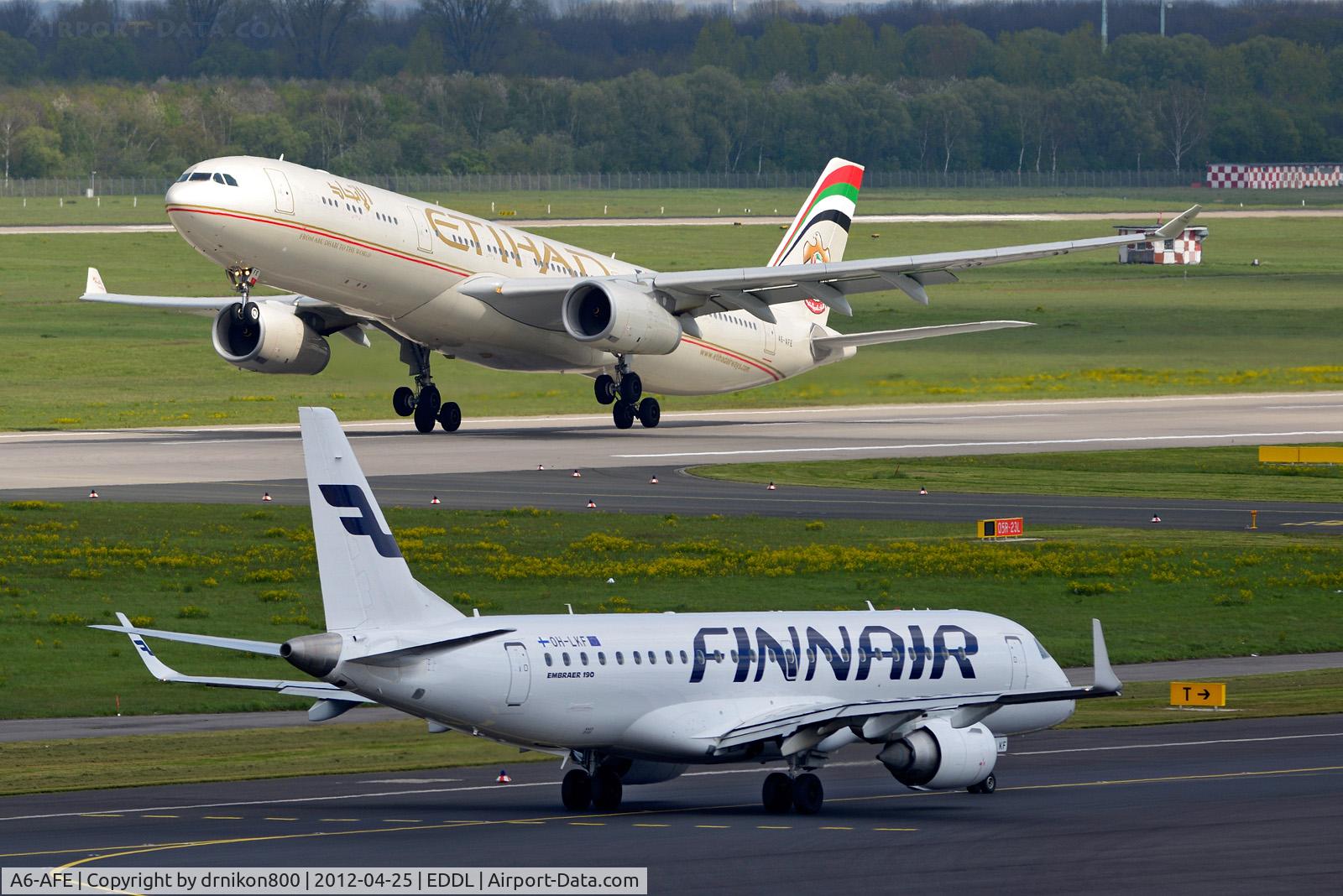 A6-AFE, 2011 Airbus A330-343X C/N 1226, A6-AFR Etihad starting 
OH-LKF Finnair on taxiway
view form main visitor terrace from Duessedorf Airport (DUS) Germany