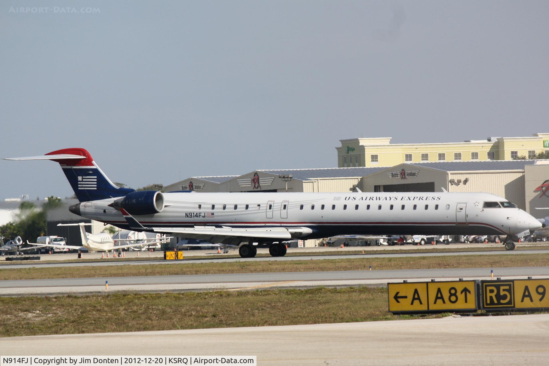 N914FJ, 2004 Bombardier CRJ-900ER (CL-600-2D24) C/N 15014, US Air Flight 2675 operated by Mesa (N914FJ) arrives at Sarasota-Bradenton International Airport following a flight from Charlotte-Douglas International Airport