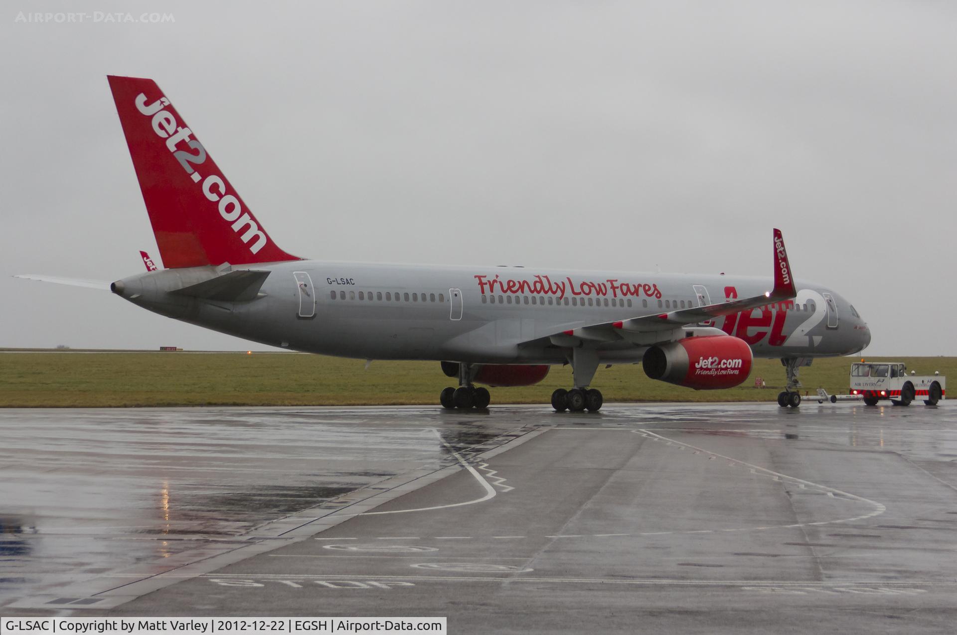 G-LSAC, 1992 Boeing 757-23A C/N 25488, Being towed to the Air Livery hangar in very dull and wet conditions.