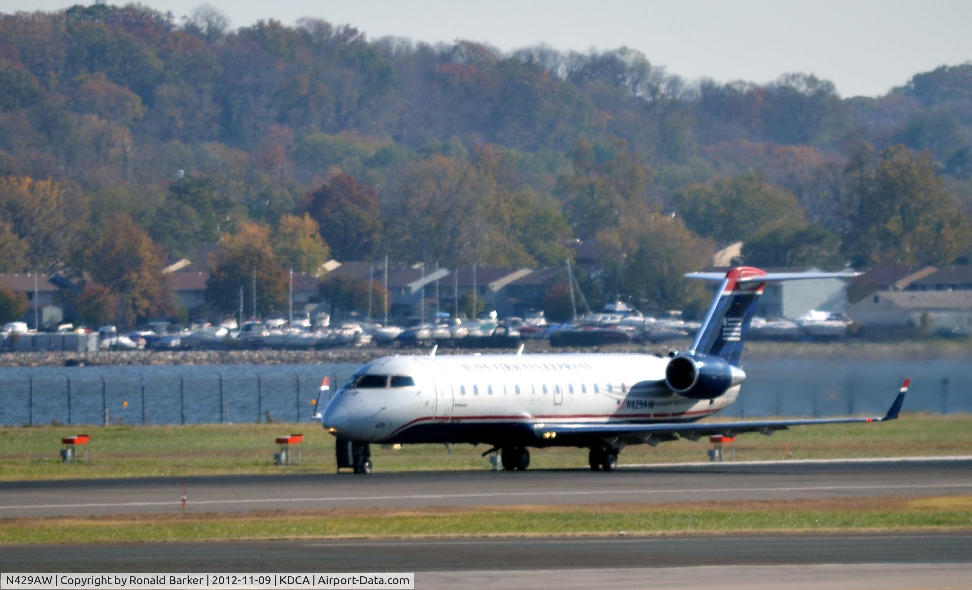N429AW, 2002 Bombardier CRJ-200LR (CL-600-2B19) C/N 7711, Takeoff DCA