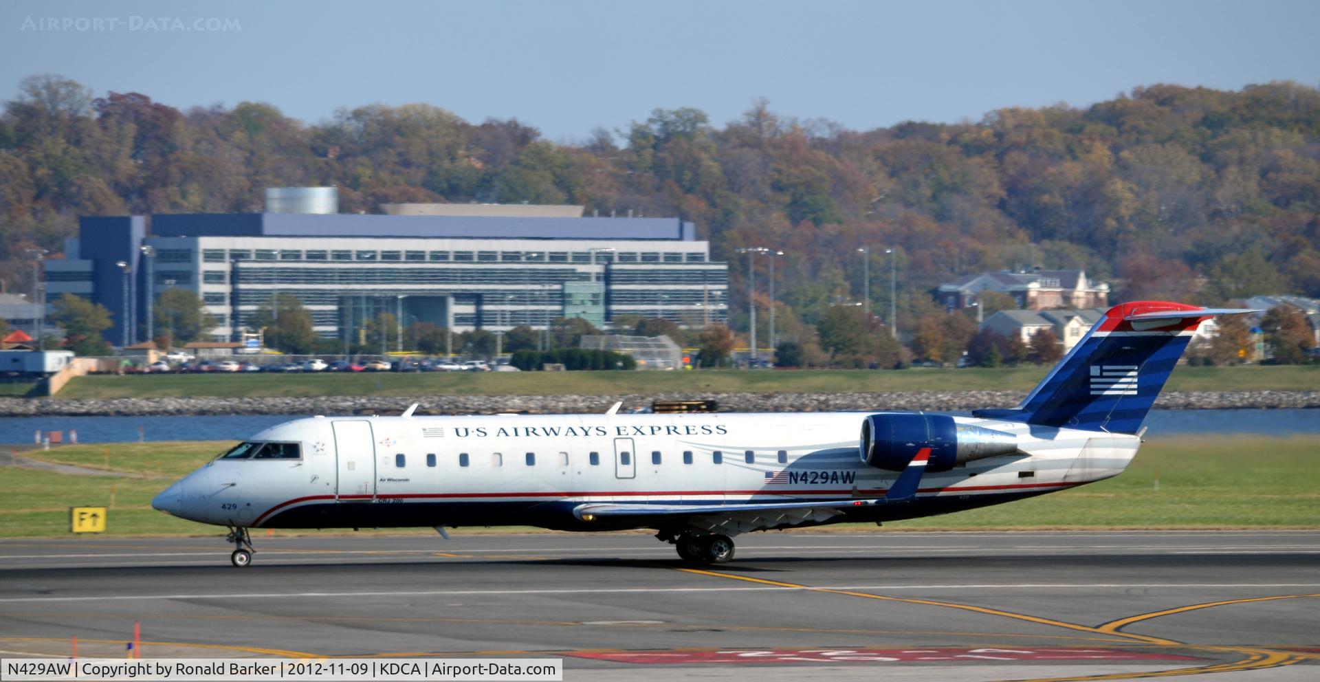 N429AW, 2002 Bombardier CRJ-200LR (CL-600-2B19) C/N 7711, Takeoff DCA